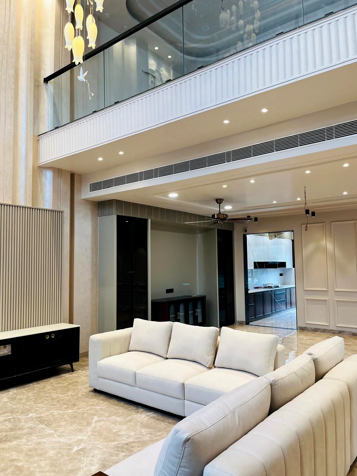 Double-height living interior project by SNH Construction