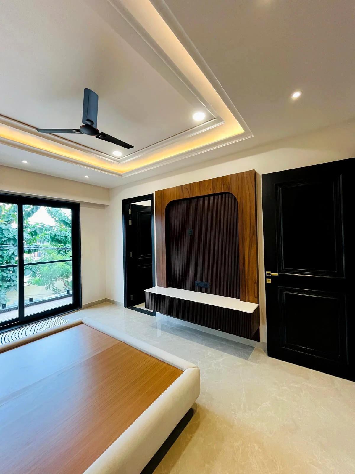 Premium TV wall interior project by SNH Construction